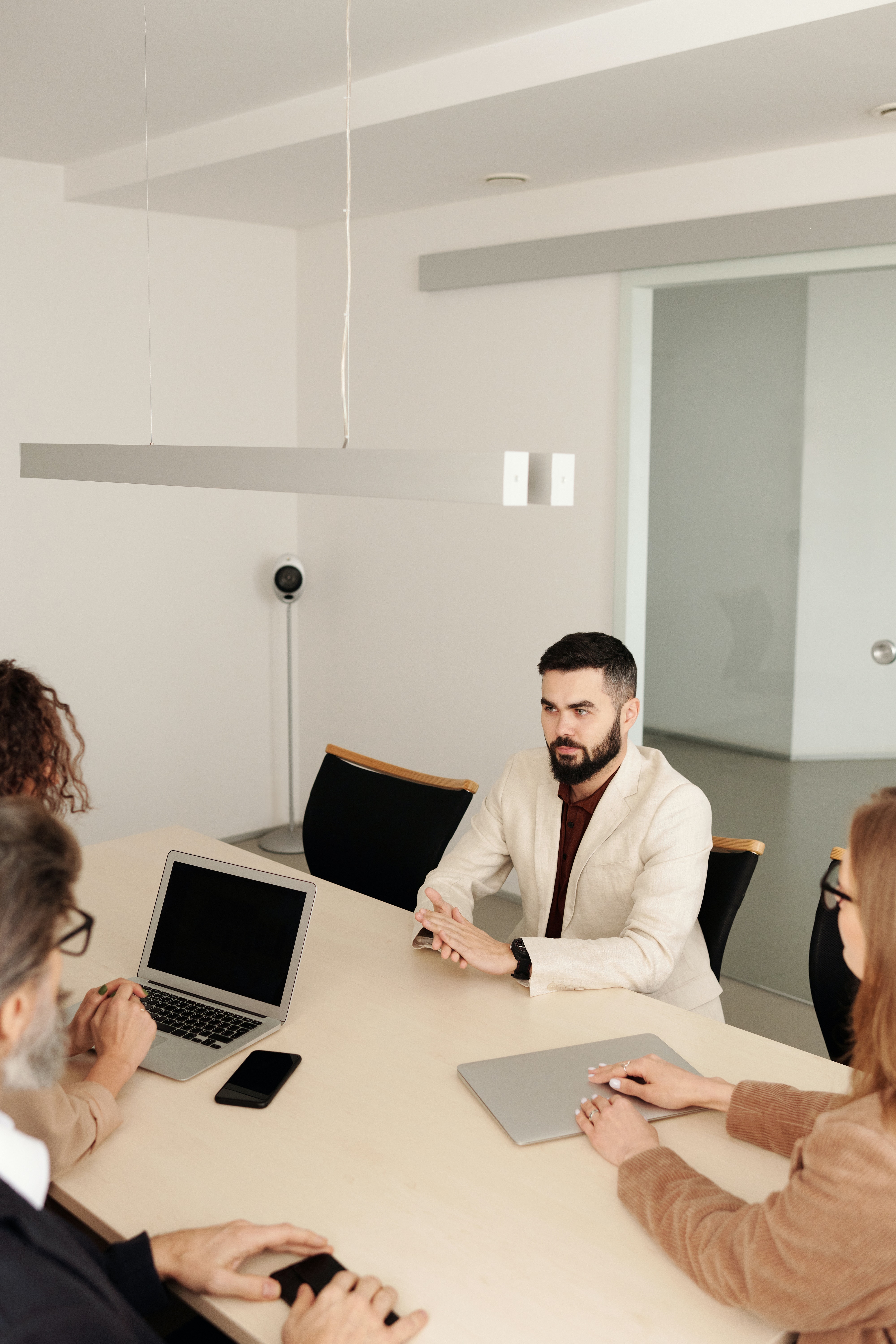 Consultants collaborating around a meeting table